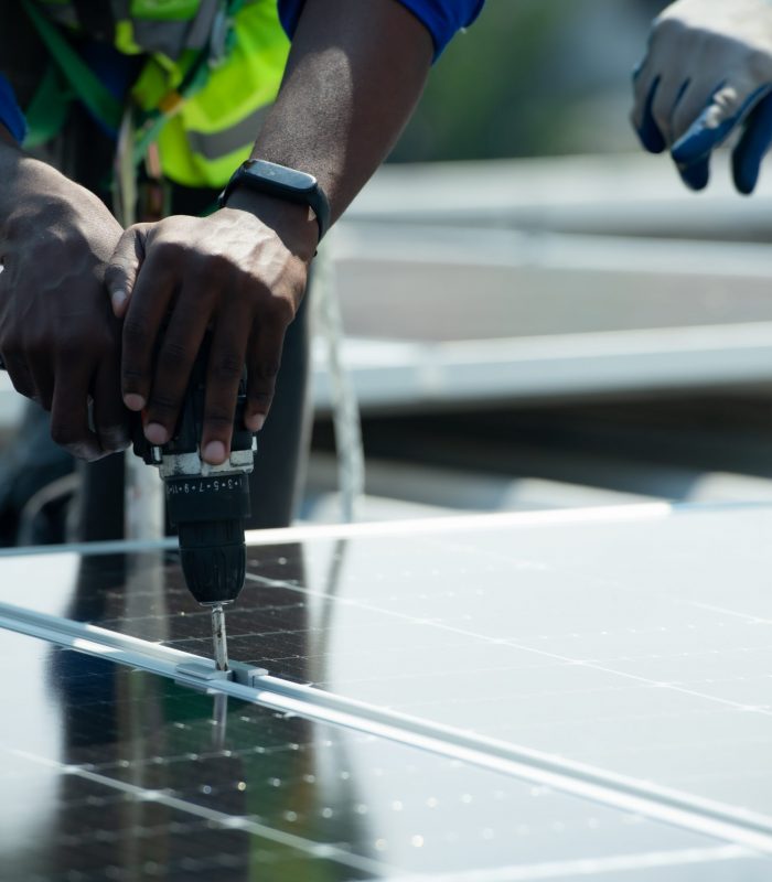 Both of Engineer in charge of solar panel installation The installation of solar energy conversion into electricity for a warehouse is currently being investigated.